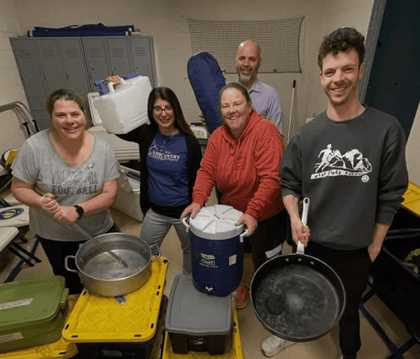 Discovery leaders gather cooking supplies in preparation for the trip.